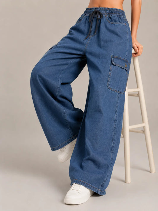 Medium blue baggy cargo jeans for girls back view