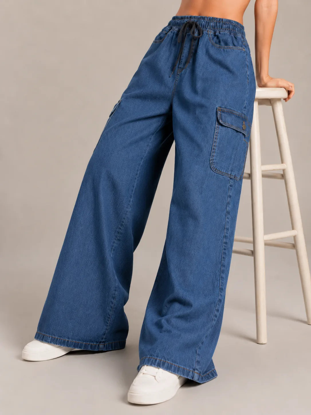 Medium blue baggy cargo jeans for girls back view