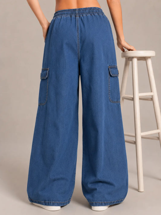 Medium blue baggy cargo jeans for girls back view